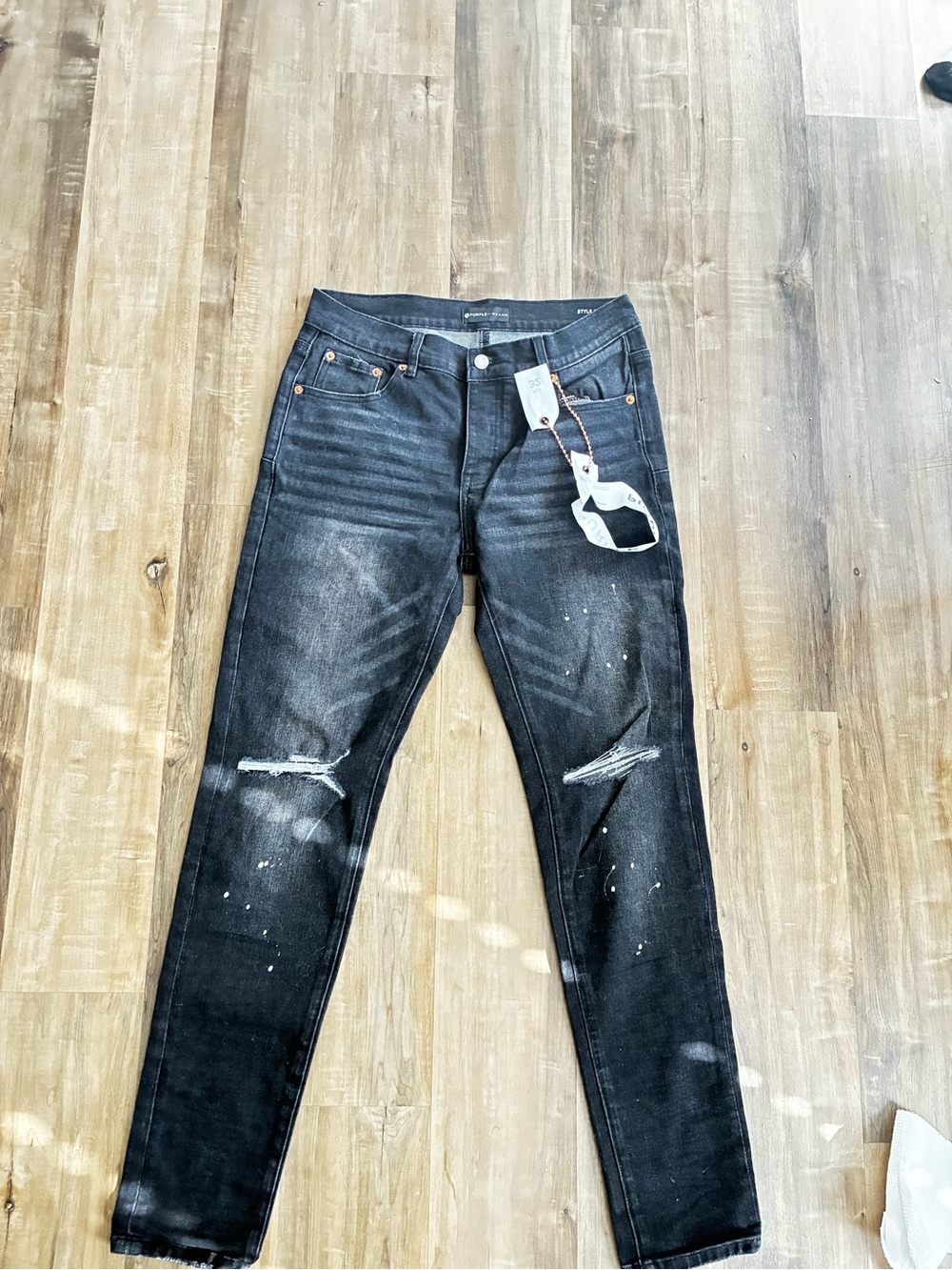 Men's Black Skinny Ripped Jeans with Paint-Splash Accent